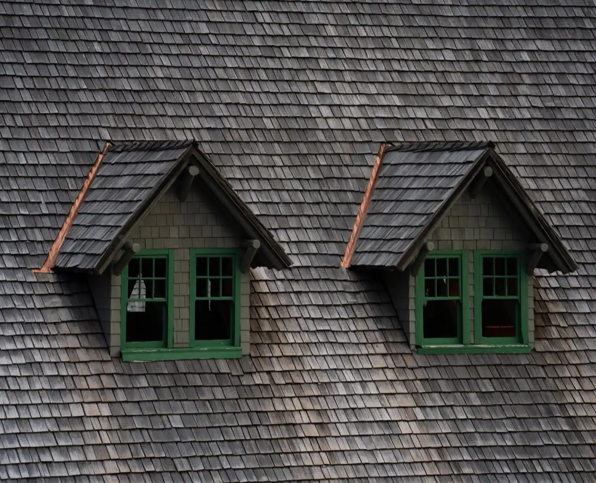 Dormers on a shingle roof in Hampton, VA, where step flashing and kickout flashing carry water past the walls